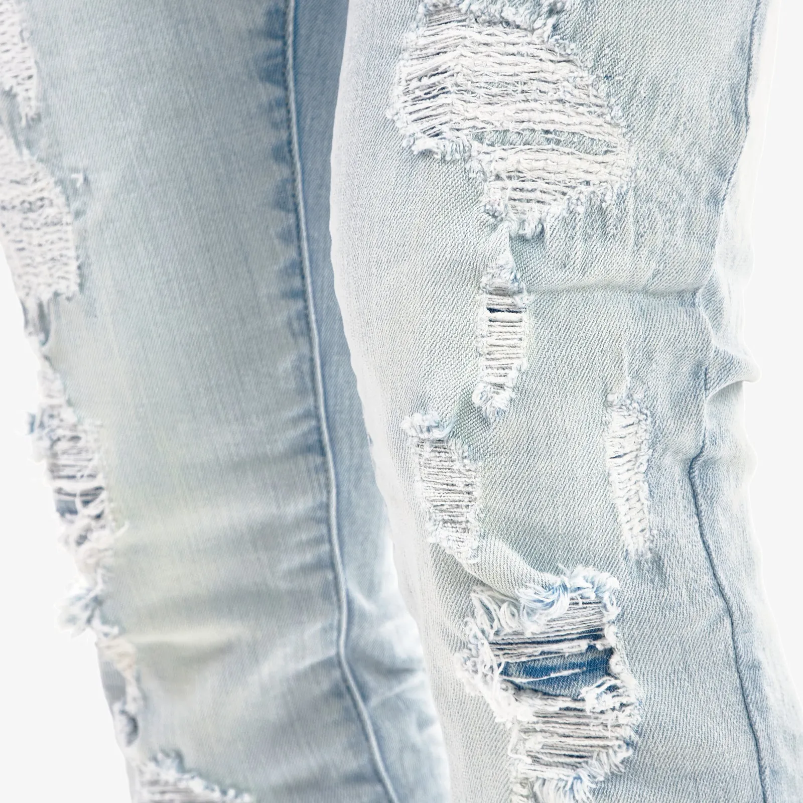 LIGHT SAND BLUE JEANS W/ RIP & REPAIR
