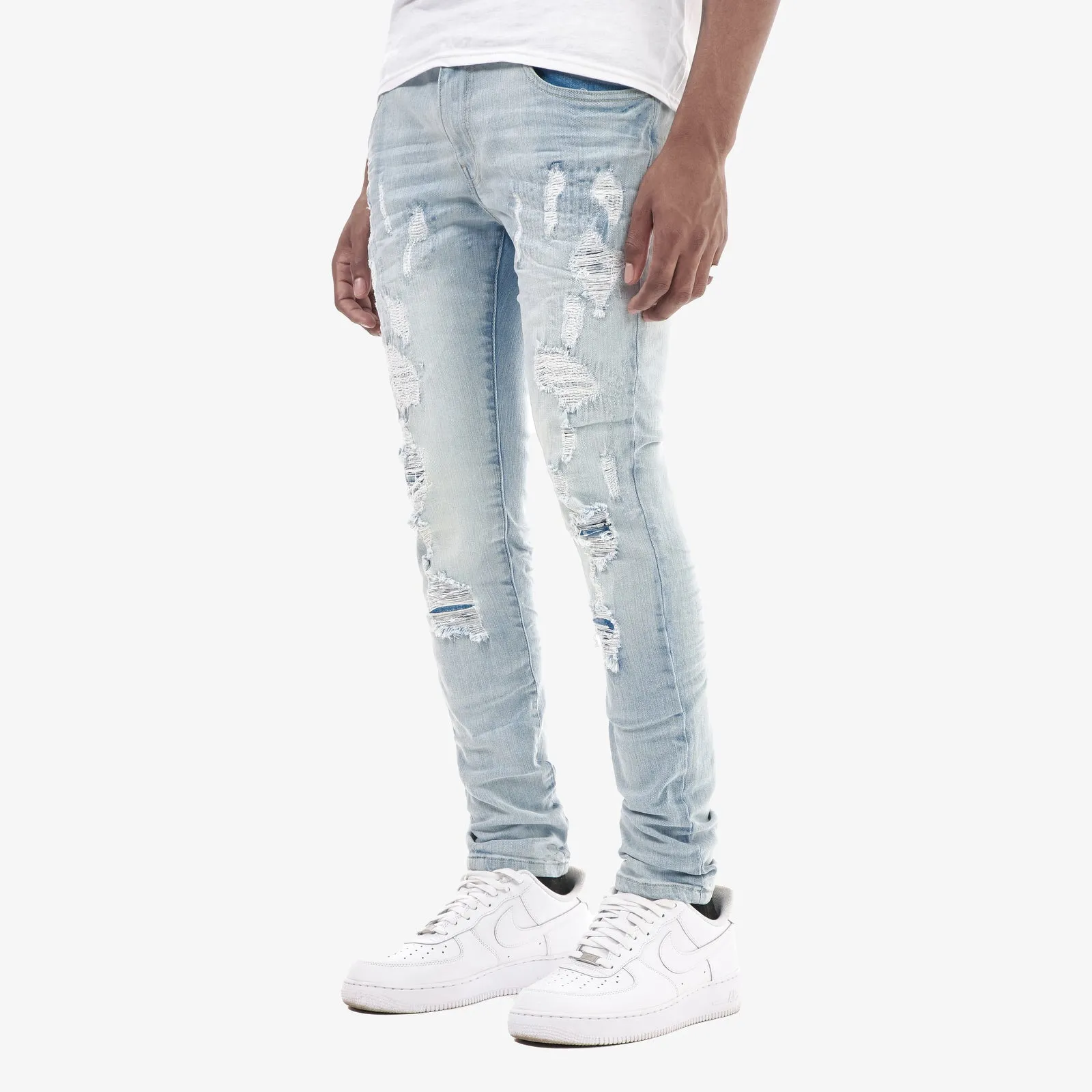 LIGHT SAND BLUE JEANS W/ RIP & REPAIR